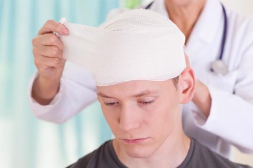 A man getting treatment for a head injury he suffered at work.