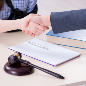 This is an image of a concord personal injury lawyer shaking hands with client