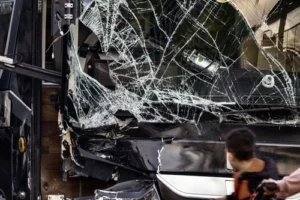 A bus windshield is completely broken after a crash and requires a bus accident lawyer in North Carolina.
