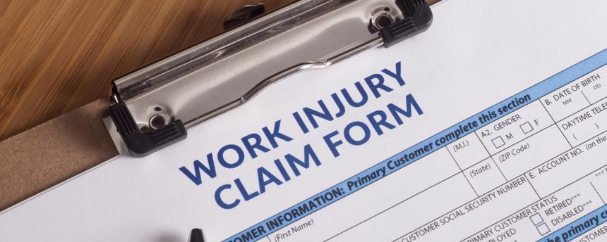 This image shows a workers compensation injury form on a clipboard.