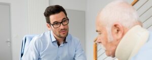 a man over 65 meeting a workers comp lawyer