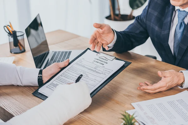 A Charlotte workers' compensation lawyer reviewing a client’s workers’ comp case.