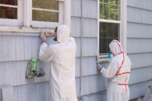 Workers In Hazmat Suits - Occupational Diseases