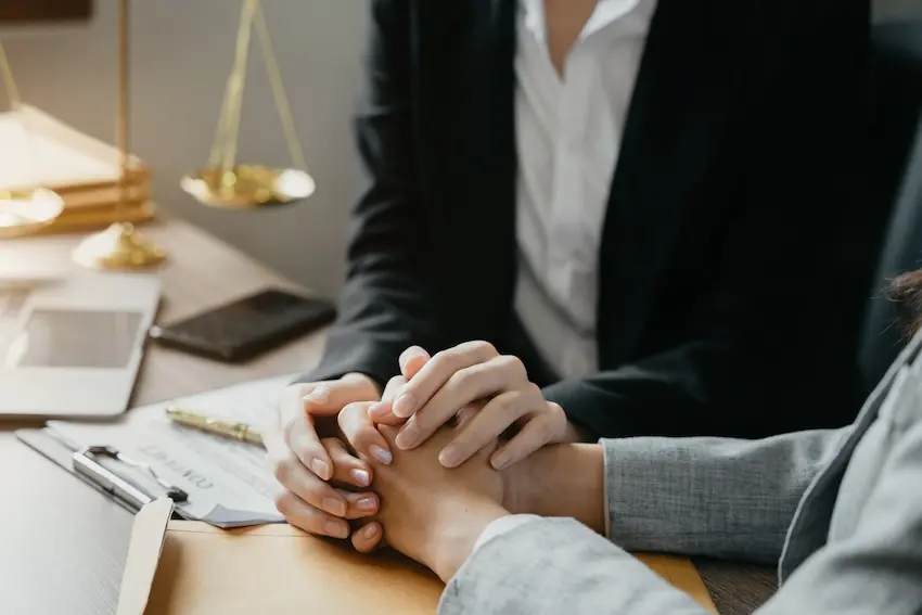 Car accident attorney consulting with client about insurance settlement offer and legal options