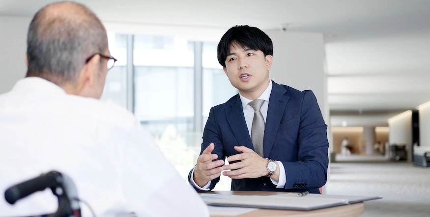 A Charlotte disability lawyer is speaking to a client.