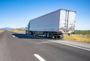 18-wheeler truck on the side of the road after an accident emphasizing the importance of contacting a truck accident lawyer for legal guidance.