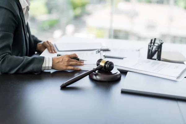 A Charlotte personal injury lawyer reviews legal documents for a case.